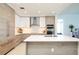 Modern kitchen with light wood cabinets and a large island at 301 1St S St # 804, St Petersburg, FL 33701
