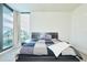 Sunlit bedroom with large window and neutral decor at 301 1St S St # 804, St Petersburg, FL 33701