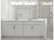 Modern bathroom with double vanity and glass shower at 319 15Th N St, St Petersburg, FL 33705