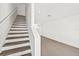 Modern staircase leading to the upper level with gray laminate treads at 319 15Th N St, St Petersburg, FL 33705