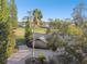 Aerial view of the home highlighting the lush surroundings and mature trees at 5474 Kemkerry Rd, Wesley Chapel, FL 33543