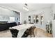 Dining room with tiled floors and chandelier and view to living room at 5474 Kemkerry Rd, Wesley Chapel, FL 33543
