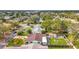 Aerial view of a house with a yard and shed, in a quiet neighborhood at 5529 11Th N Ave, St Petersburg, FL 33710
