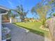 Large backyard with lush lawn, shed, and wooden fence at 5529 11Th N Ave, St Petersburg, FL 33710