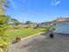 Landscaped backyard with two storage sheds and a gravel area at 5529 11Th N Ave, St Petersburg, FL 33710