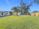 Large backyard featuring two storage sheds and a grassy area at 5529 11Th N Ave, St Petersburg, FL 33710