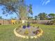 Landscaped backyard with circular garden at 5529 11Th N Ave, St Petersburg, FL 33710