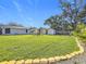 Expansive backyard with two sheds and a neatly landscaped lawn at 5529 11Th N Ave, St Petersburg, FL 33710
