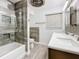 Renovated bathroom with a tub/shower combo and stylish tile at 5529 11Th N Ave, St Petersburg, FL 33710