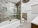 Renovated bathroom with a tub/shower combo and stylish tile at 5529 11Th N Ave, St Petersburg, FL 33710