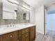 Double vanity bathroom with modern lighting and storage at 5529 11Th N Ave, St Petersburg, FL 33710