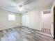 Bedroom with double door closet and wood-look flooring at 5529 11Th N Ave, St Petersburg, FL 33710