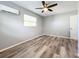 Bedroom with ceiling fan and wood-look flooring at 5529 11Th N Ave, St Petersburg, FL 33710