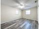 Bedroom with ceiling fan and wood-look flooring at 5529 11Th N Ave, St Petersburg, FL 33710
