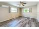 Bedroom with window and wood-look flooring at 5529 11Th N Ave, St Petersburg, FL 33710
