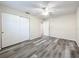 Bedroom with ceiling fan and wood-look flooring at 5529 11Th N Ave, St Petersburg, FL 33710