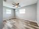Bright bedroom with ceiling fan and wood-look flooring at 5529 11Th N Ave, St Petersburg, FL 33710
