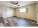 Spacious bedroom featuring wood-look floors and a ceiling fan at 5529 11Th N Ave, St Petersburg, FL 33710