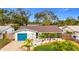 Attractive single-story home with teal garage door and landscaped yard at 5529 11Th N Ave, St Petersburg, FL 33710