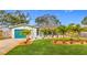 House with teal garage door and nicely landscaped front yard at 5529 11Th N Ave, St Petersburg, FL 33710