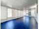 Bright Florida room with blue tile floor and backyard access at 5529 11Th N Ave, St Petersburg, FL 33710