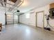 Spacious garage with overhead storage and epoxy flooring at 5529 11Th N Ave, St Petersburg, FL 33710