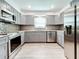 Modern gray kitchen with stainless steel appliances and granite countertops at 5529 11Th N Ave, St Petersburg, FL 33710