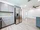 Modern kitchen with gray cabinets, granite countertops, and stainless steel appliances at 5529 11Th N Ave, St Petersburg, FL 33710
