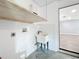 Clean laundry room with utility sink and built-in shelving at 5529 11Th N Ave, St Petersburg, FL 33710