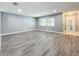 Gray walls, wood-look floors, and a view into entryway at 5529 11Th N Ave, St Petersburg, FL 33710