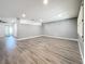 Spacious living room with gray walls and wood-look floors at 5529 11Th N Ave, St Petersburg, FL 33710