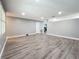 Bright living room featuring gray walls and wood-look floors at 5529 11Th N Ave, St Petersburg, FL 33710