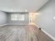 Living room with gray walls, wood-look floors, and window at 5529 11Th N Ave, St Petersburg, FL 33710