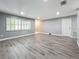 Spacious living room with gray walls and wood-look floors at 5529 11Th N Ave, St Petersburg, FL 33710