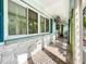 Long, bright screened porch with tiled floor at 5529 11Th N Ave, St Petersburg, FL 33710