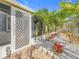 Side entrance with screen door and landscaping at 5529 11Th N Ave, St Petersburg, FL 33710