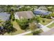 Inviting two-story home features a well-manicured lawn, solar panels, and lush landscaping for enhanced curb appeal at 6650 Current Dr, Apollo Beach, FL 33572