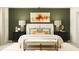 Primary bedroom with a king-size bed and stylish decor at 8447 Bella Mar Trl, Parrish, FL 34219