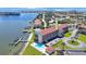 Aerial view showcasing building and waterfront location at 8701 Blind Pass Rd # 306B, St Pete Beach, FL 33706