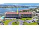 Aerial view of condo building showcasing water views and parking at 8701 Blind Pass Rd # 306B, St Pete Beach, FL 33706