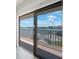 Balcony with water view and metal railing at 8701 Blind Pass Rd # 306B, St Pete Beach, FL 33706