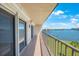 Spacious balcony with sliding doors and water views at 8701 Blind Pass Rd # 306B, St Pete Beach, FL 33706