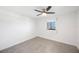 Bright bedroom with ceiling fan and tile floor at 8701 Blind Pass Rd # 306B, St Pete Beach, FL 33706