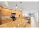 Open kitchen with island, granite counters, and stainless steel appliances at 8701 Blind Pass Rd # 306B, St Pete Beach, FL 33706