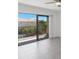 Living room with sliding glass doors and balcony access at 8701 Blind Pass Rd # 306B, St Pete Beach, FL 33706