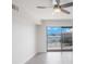 Living room with water view and sliding glass doors at 8701 Blind Pass Rd # 306B, St Pete Beach, FL 33706