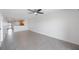 Open living room with kitchen view and tile floors at 8701 Blind Pass Rd # 306B, St Pete Beach, FL 33706