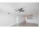 Spacious living room with ceiling fan and tile floors at 8701 Blind Pass Rd # 306B, St Pete Beach, FL 33706