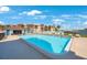 Inviting community pool with lounge chairs at 8701 Blind Pass Rd # 306B, St Pete Beach, FL 33706