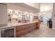 Spacious kitchen island with granite countertops, a beverage fridge, and sleek wooden cabinetry at 1000 Chillum Ct, Safety Harbor, FL 34695